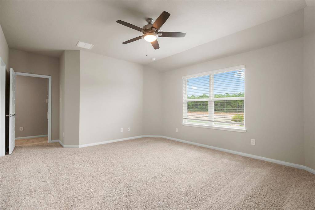 Primary bedroom has a view of the back yard and beyond. No rear neighbors!