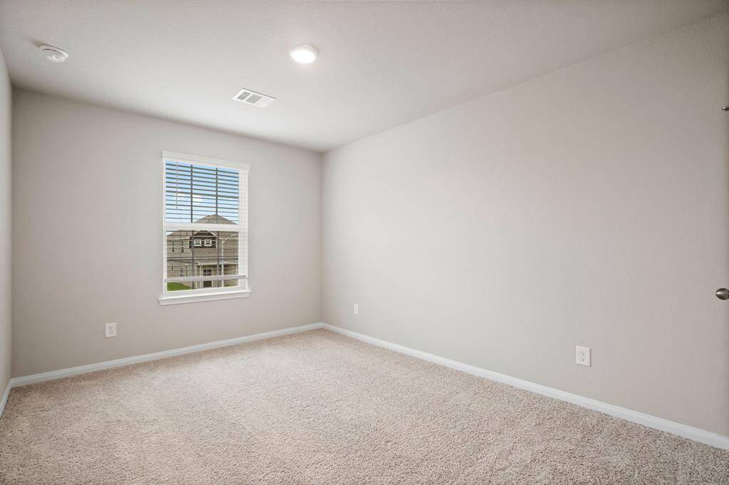 Secondary bedroom in the front of the home