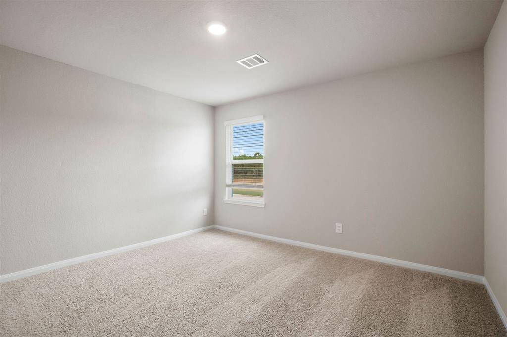 Third secondary bedroom located in the back of the home