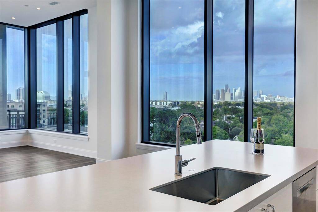 Throughout this elegant residence designed by Mirador Group and developed by Pelican Builders, you'll find 12-foot-tall ceilings dotted with recessed lighting, rich wide-plank hardwood floors, wide art walls and premium finishes.