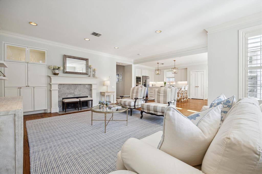 Spacious den with inviting fireplace for cozy evenings and relaxation.