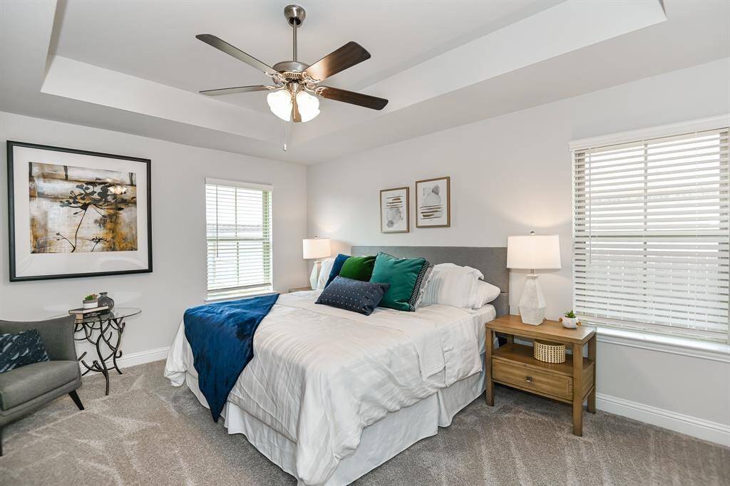 The Primary Bedroom *Stock photo- Colors & finishes may be different