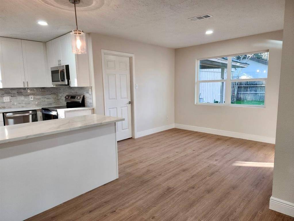 Kitchen open to living and formal dining room
