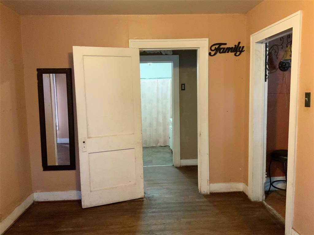 Looking into the section of the house where the two bedrooms  and bathroom are