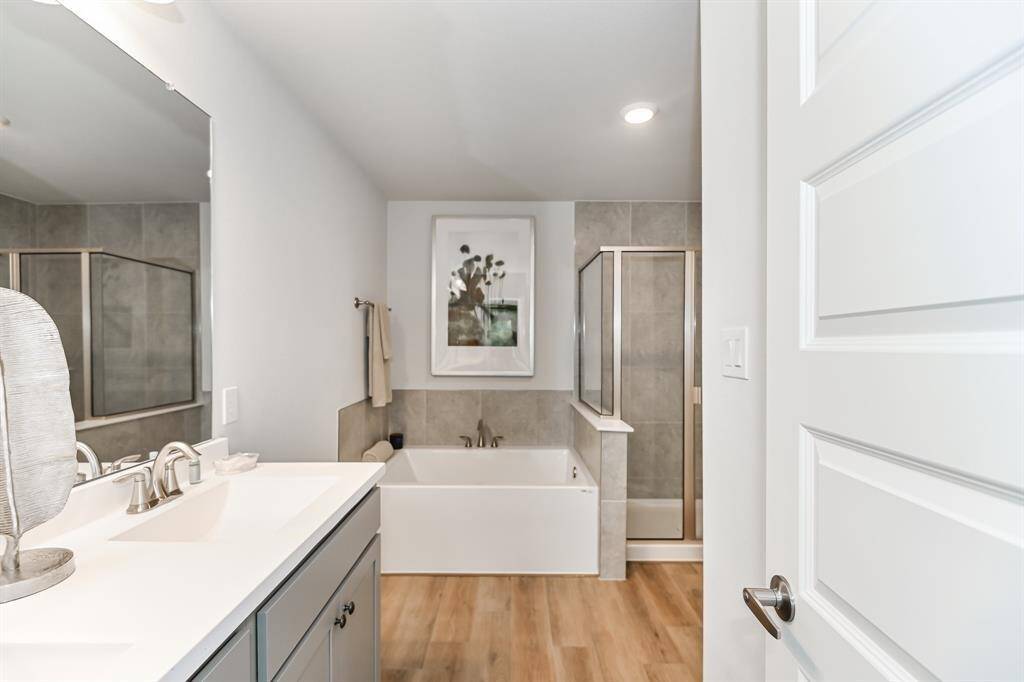 The Primary Bathroom *Stock photo- Colors & finishes may be different