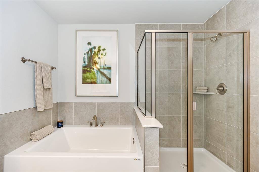 Separate Tub/ Shower in the Primary Bathroom *Stock photo- Colors & finishes may be different