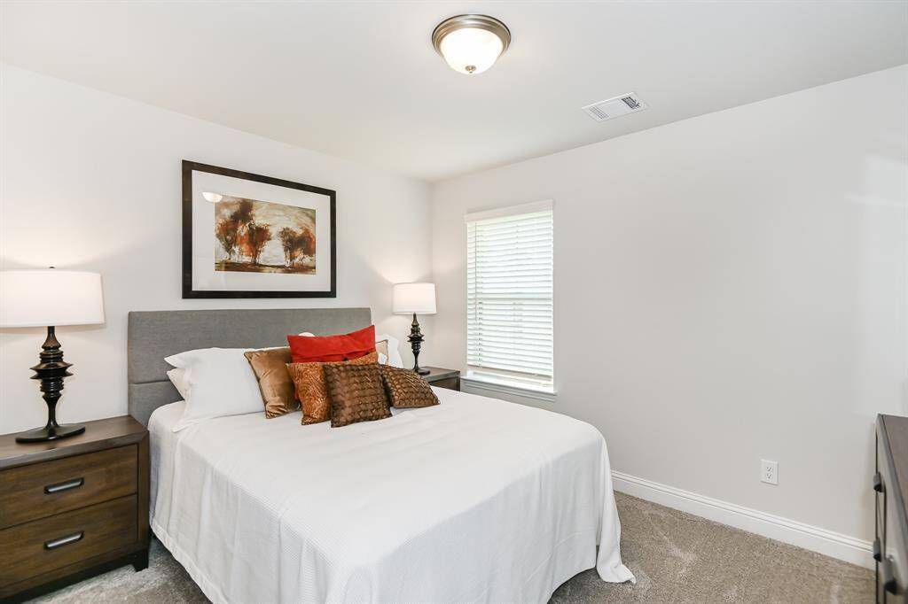 Secondary Bedroom *Stock photo- Colors & finishes may be different