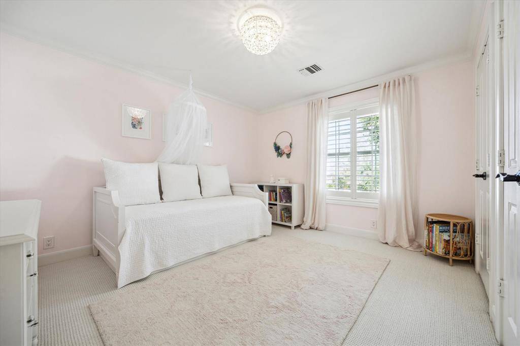 Another charming roomy secondary bedroom with window to front yard.