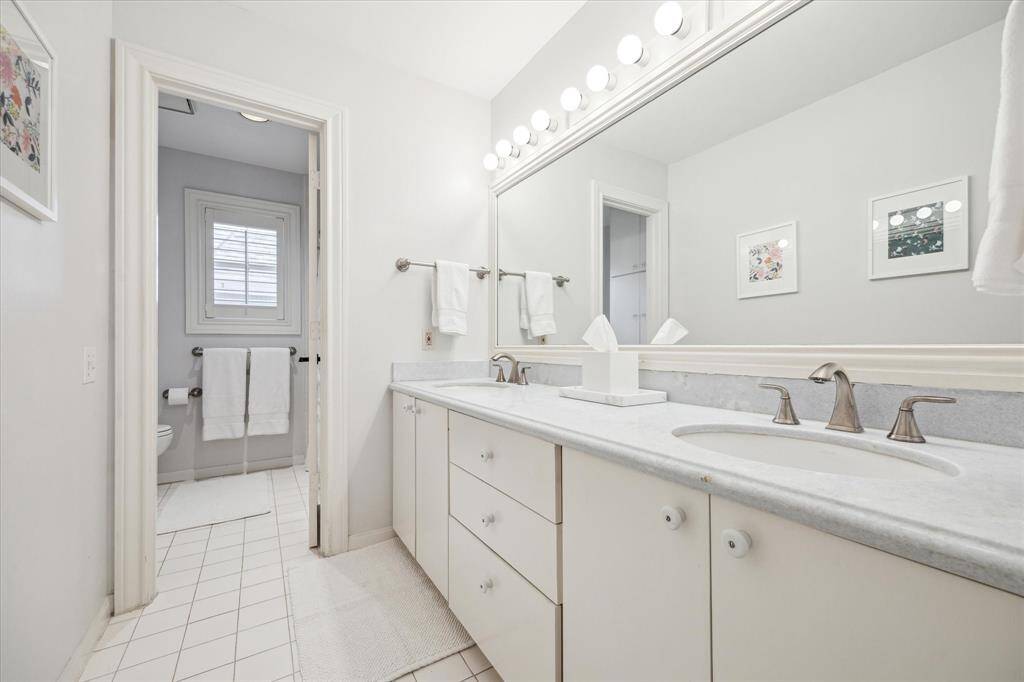 Secondary bath with double sinks.