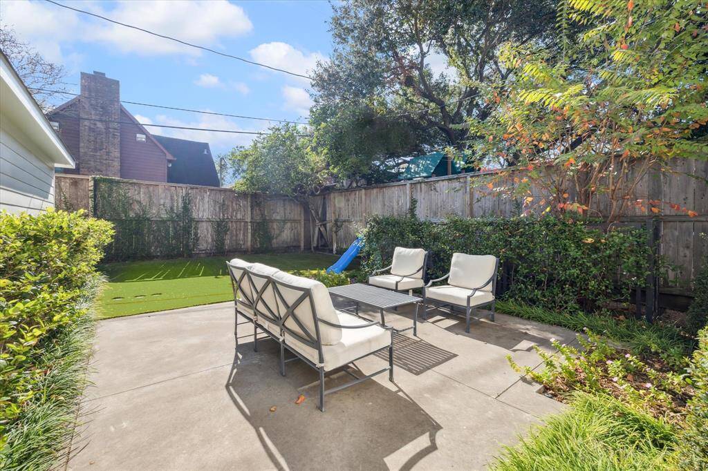 Backyard patio and artificial turf.
