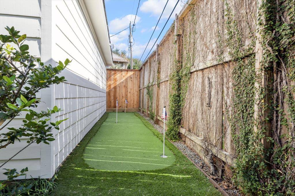 Backyard putting green behind the garage.