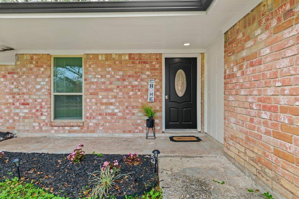 Approaching the front door you will see the brick elevation and covered front porch.