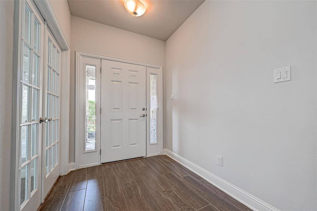 Study/ 4th Bedroom is just off of the entrance *Stock photo- Colors & finishes may be different
