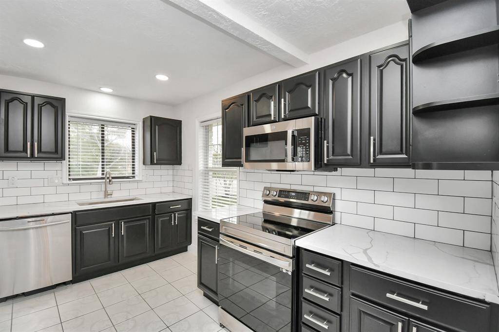 Spacious Kitchen, Featuring Updated Countertops and Back Splash