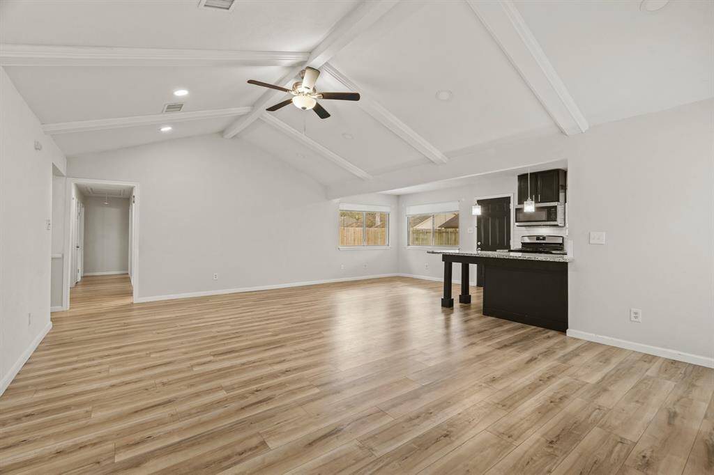 Another view of the bright andspacious living room.