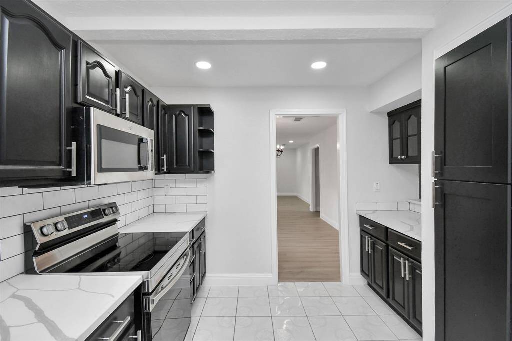 Spacious Kitchen, Featuring Updated Countertops and Back Splash