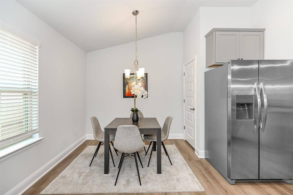 Dining Area just off of the kitchen *Stock photo- Colors & finishes may be different
