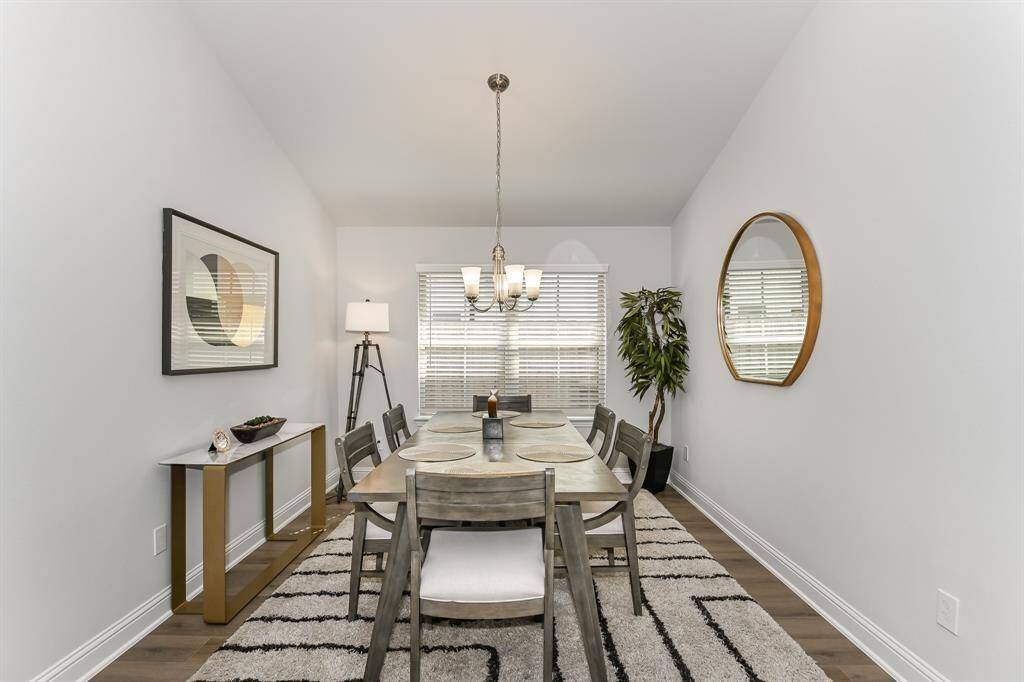 The Dining Room is located across from the kitchen *Stock photo- Colors & finishes may be different