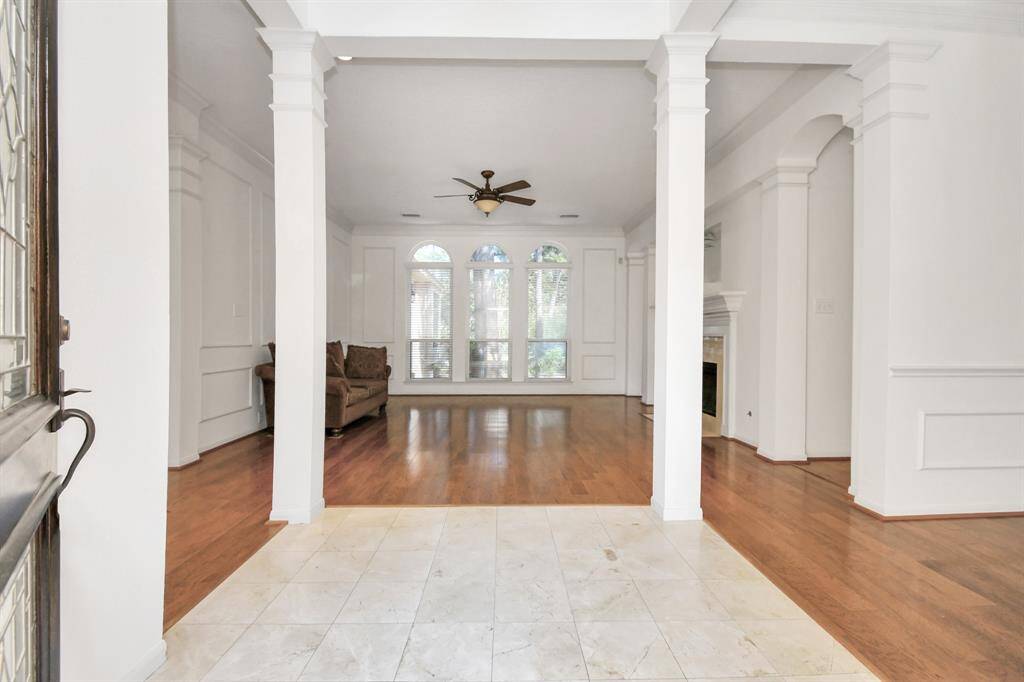 Welcome to your new home! Marble flooring!Beautiful columns and a view to the back yard!