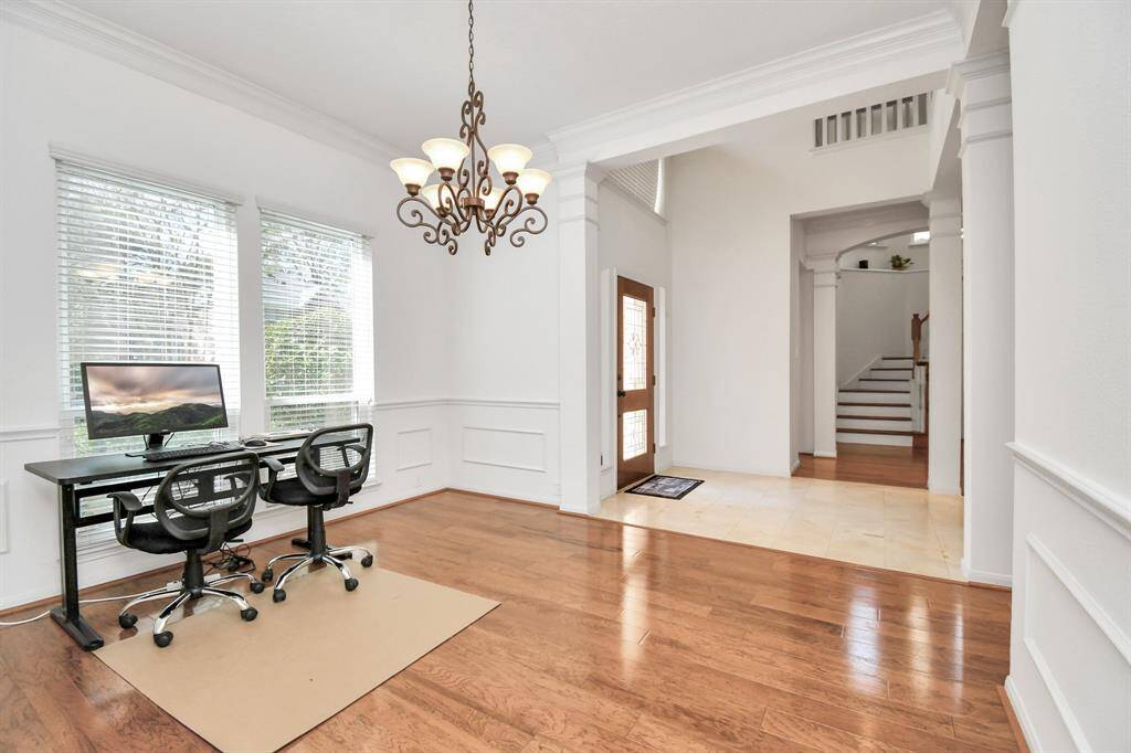 Another view from the dining room looking to the foyer and curved stairway!