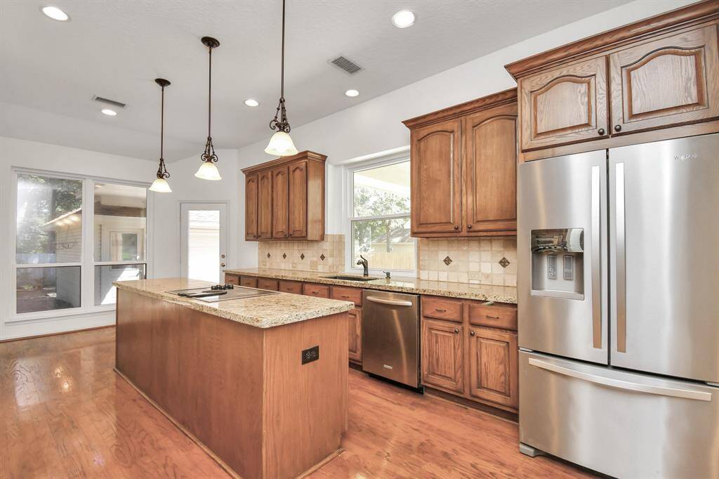 Your kitchen with granite counters with plenty of storage!