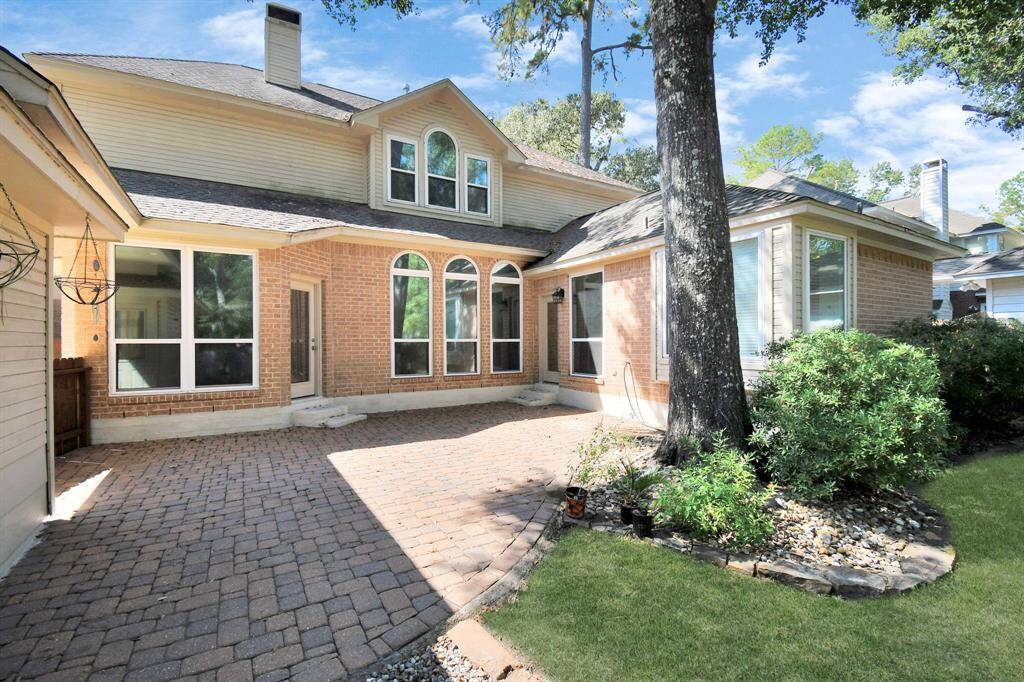 Paver back patio with 2 entrances to home.  Kitchen and primary bedroom!