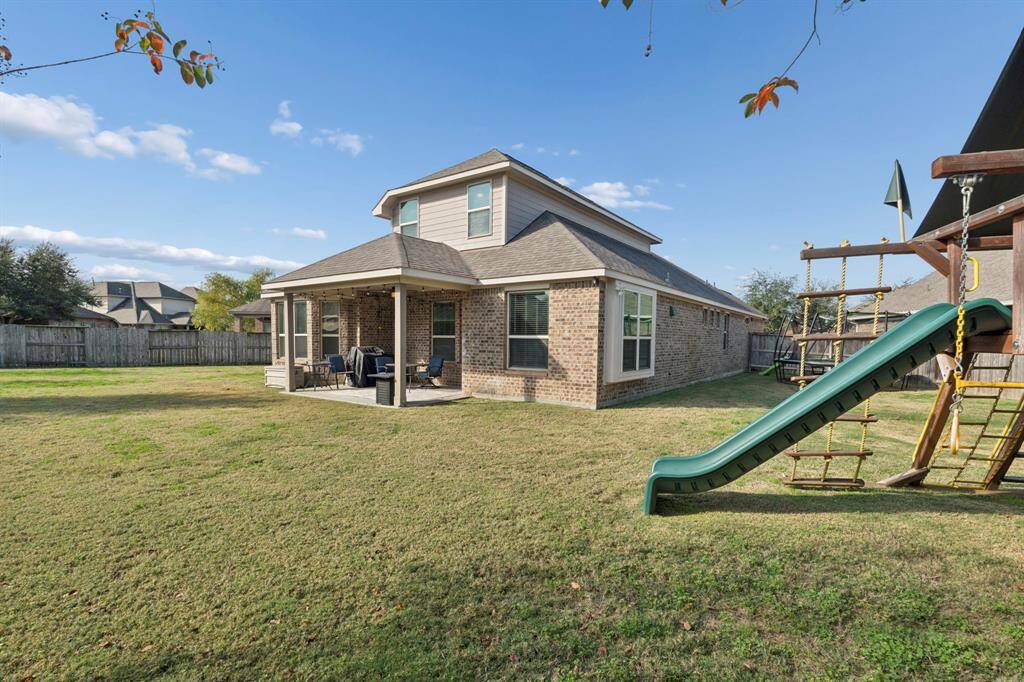 Welcome home to 2206 Wolf Creek Dr! Check out this spacious backyard