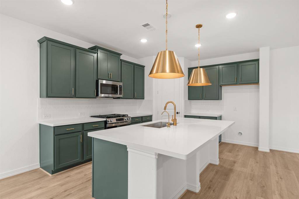 This kitchen is not only a functional space but also has ample storage. Whether you're a seasoned chef or just love to gather and enjoy good food, this kitchen is a dream come true.