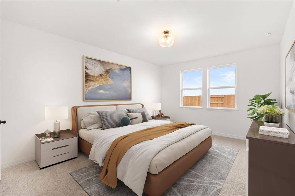The primary bedroom is generously sized, creating a tranquil and spacious retreat that offers ample room for relaxation. Featuring plush carpet, high ceilings, fresh paint, and large windows that lets in natural lighting throughout the day. Photo is virtually staged