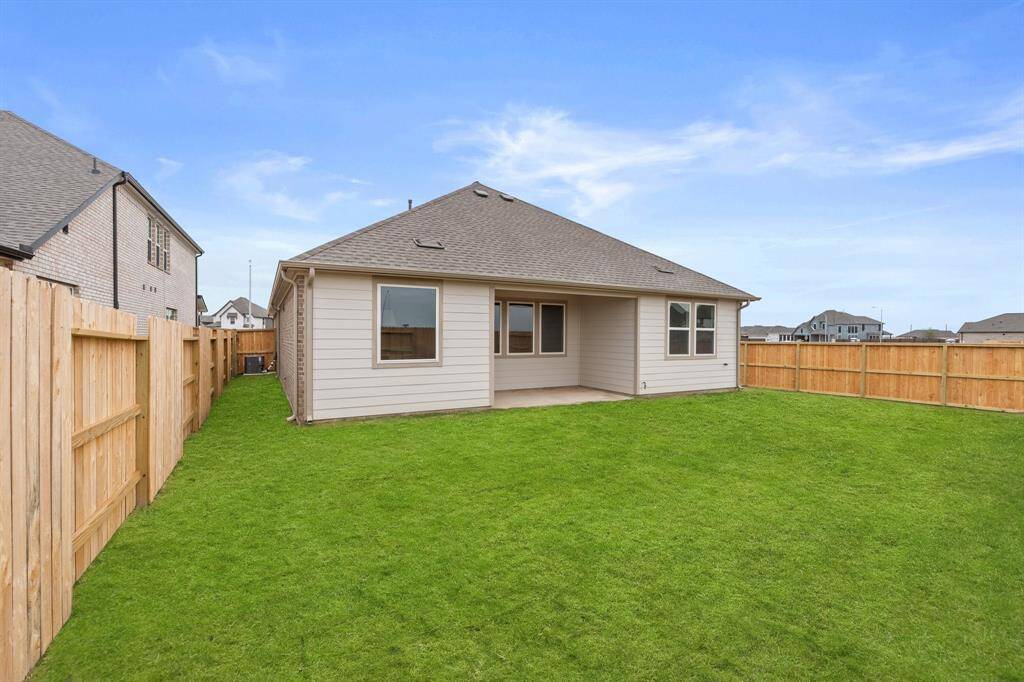 This backyard is perfect for family gatherings, social events, or simply unwinding in the fresh air.