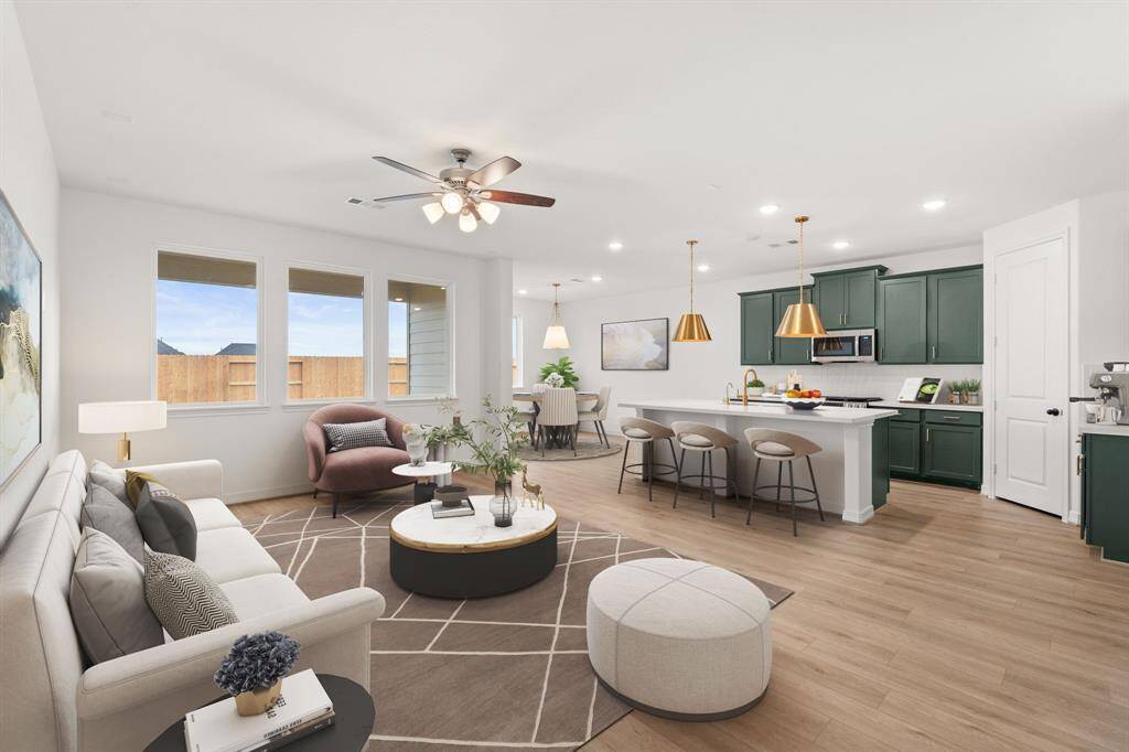 This home boasts a spacious open concept layout that combines the best of modern design and comfort for everyday living. Photo is virtually staged