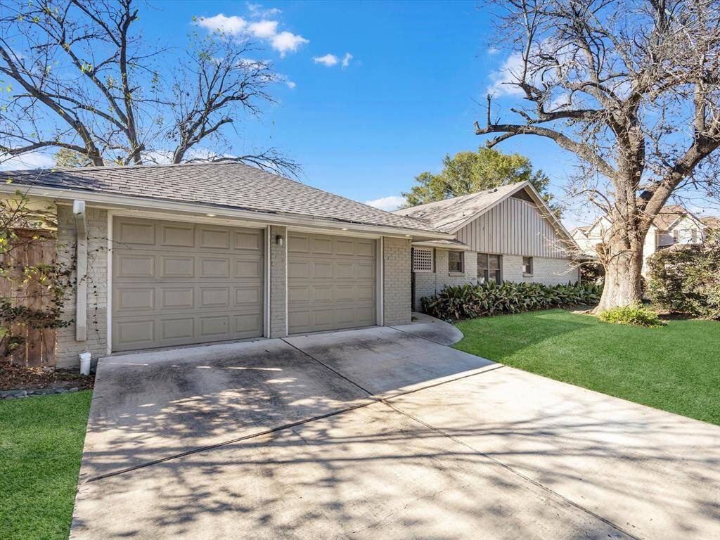 This home features a spacious two-car detached garage with a convenient covered breezeway connecting to the house.