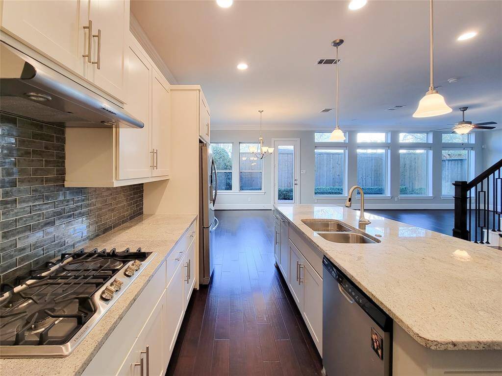 the view goes out to the manicured, private backyard, much light enters the downstairs through the xxl windows