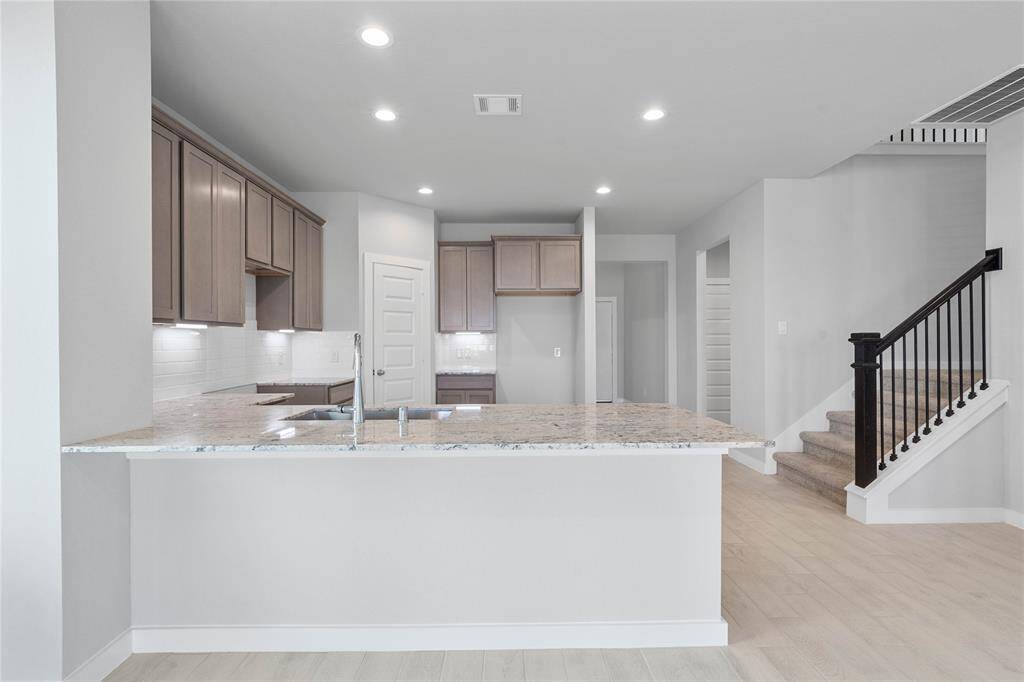 Another view of this spacious kitchen!