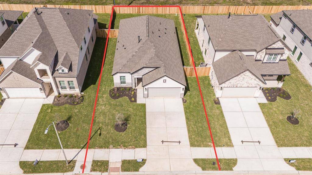 This home sits on a large lot with ample yard space in front and the back, lush landscaping and well-maintained yard!