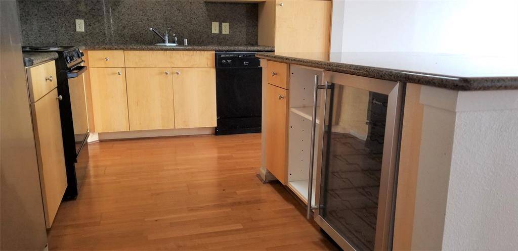 Island kitchen with wine chiller.
