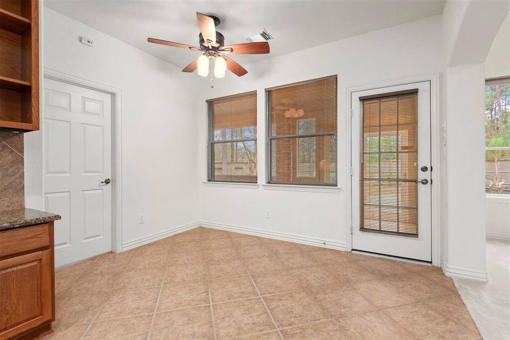 Cozy breakfast nook with natural light and easy patio access.