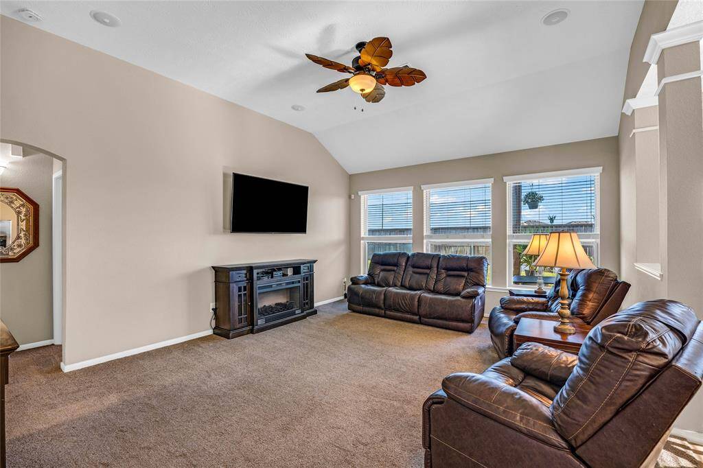 Living room with view of backyard.