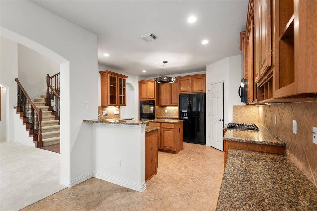 Efficient family workspace integrated into the kitchen area.
