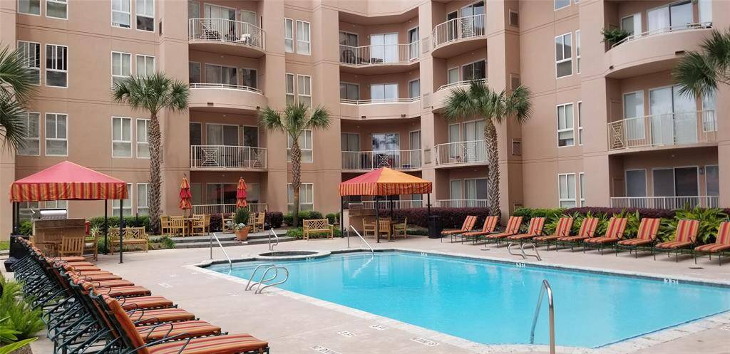Outdoor pool with plenty of seating.