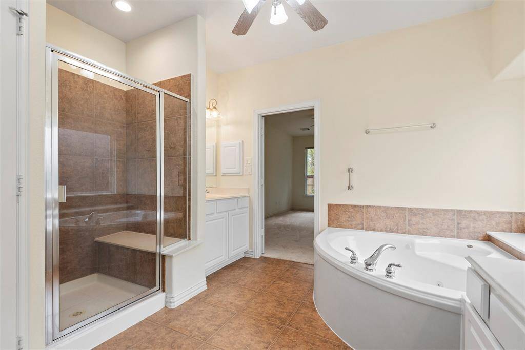 Elevated sink and spacious walk-in shower.