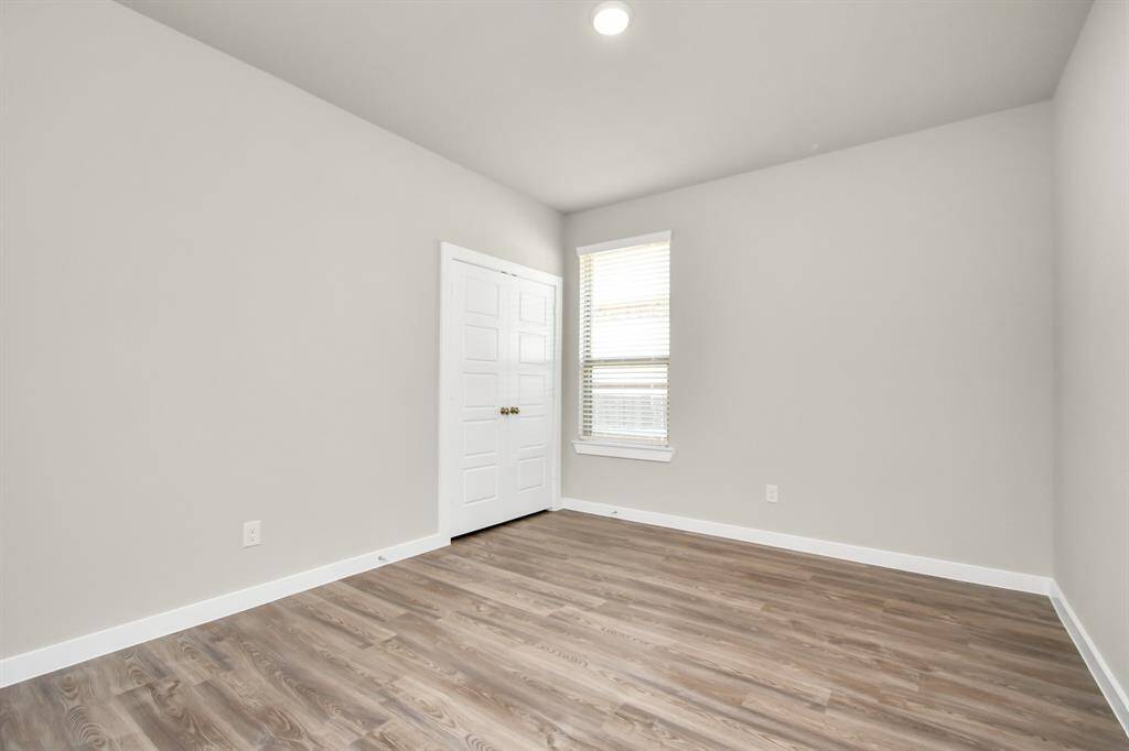 Third bedroom features alarge window.