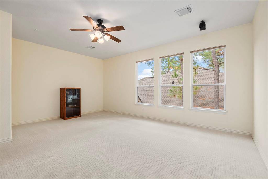 Expansive game room with speakers.