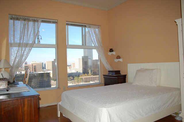 Bedroom with wonderful city views. Hardwood flooring. Large walk-in closet.