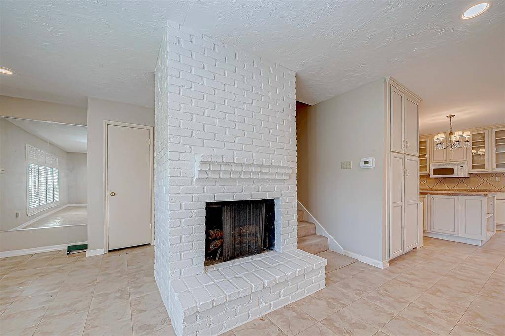 Inviting kitchen with pantry and laundry.