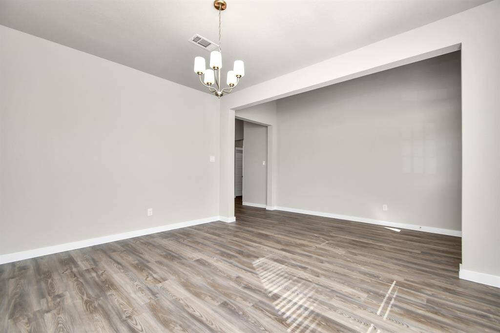 The room is enhanced by acaptivating chandelier.
