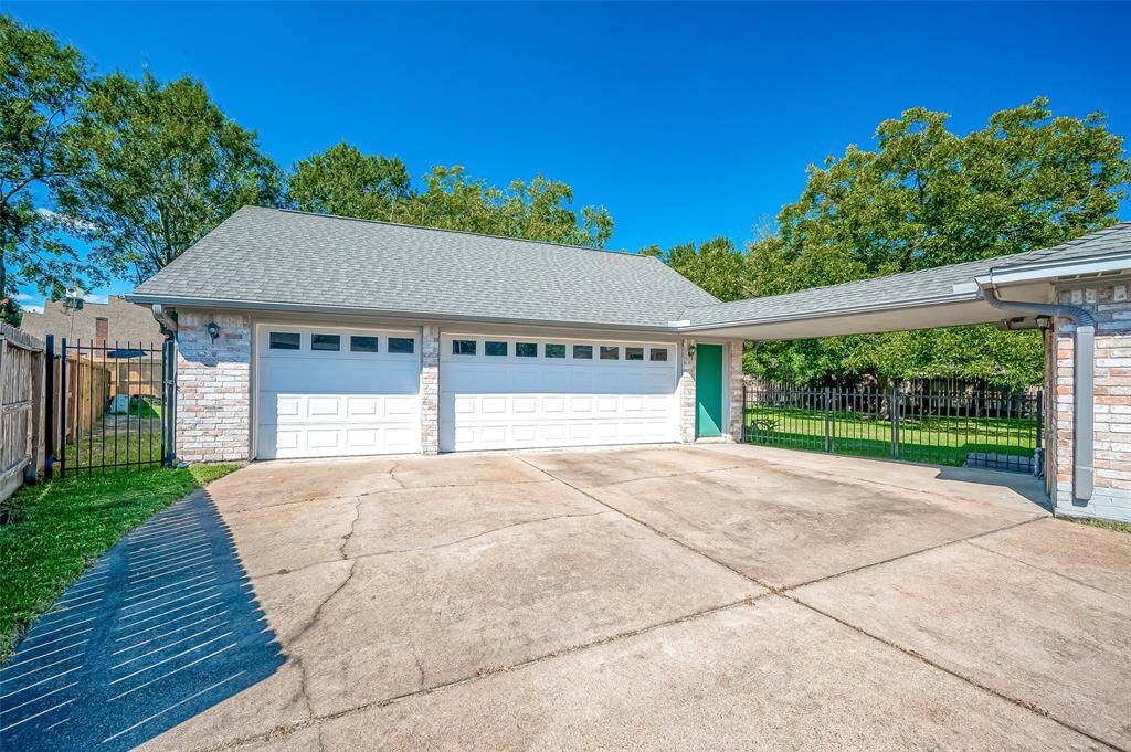 This home sits on a 16,000+ sqft lot with a long driveway leading to an impressive detached OVERSIZED 3-car garage (33 wide x 28 deep) offering ample parking. Rebuilt in 2009, the garage features an 8ft roll-up rear door for easy pull-through access for a trailer or boat as well as 500sqft of decked overhead storage. A new electrical panel was relocated to the house, and a 220 outlet was added, making it generator-ready if desired. Perfect for those seeking convenience and versatility!