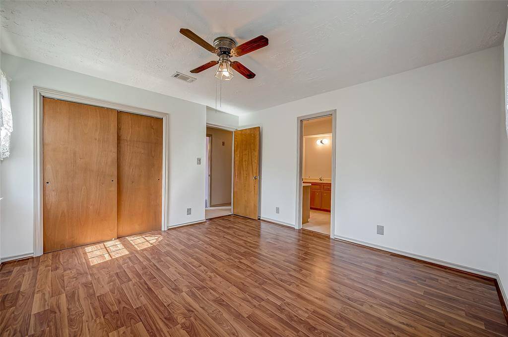 Bedroom #3 features a sliding door closet and a connecting door to the shared bathroom, providing convenient access to the bathroom for its occupants.