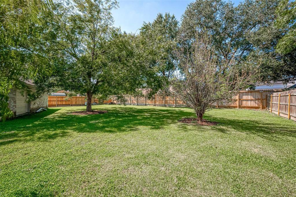 The home offers a fully fenced backyard with ample space for children and pets to run and play. There's also plenty of room to add a swimming pool if desired.