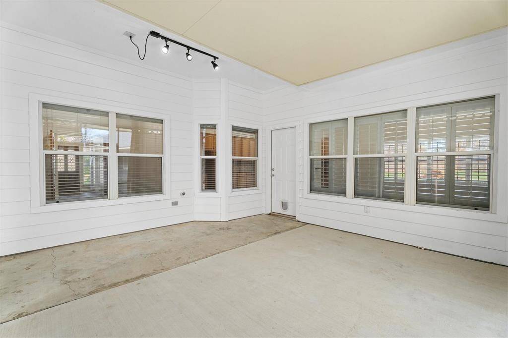 Walled in sun room perfect for a variety of entertaining and/or other hobbies.